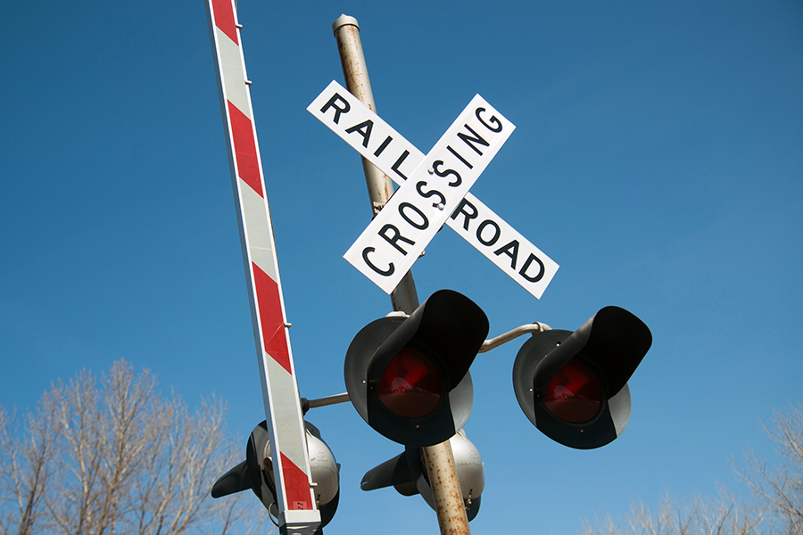 Railroad crossing sign and barrier.