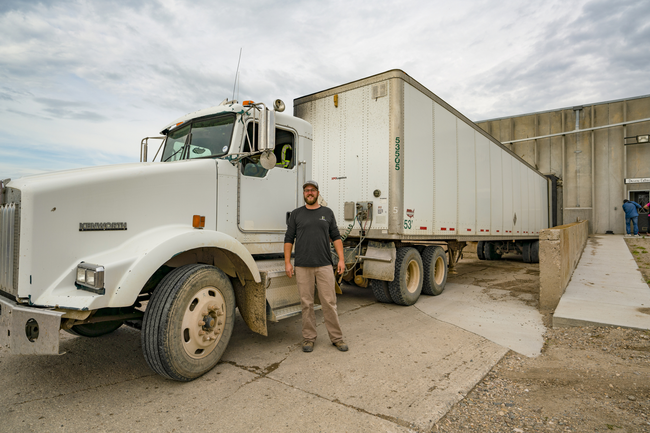 Driver next to white truck