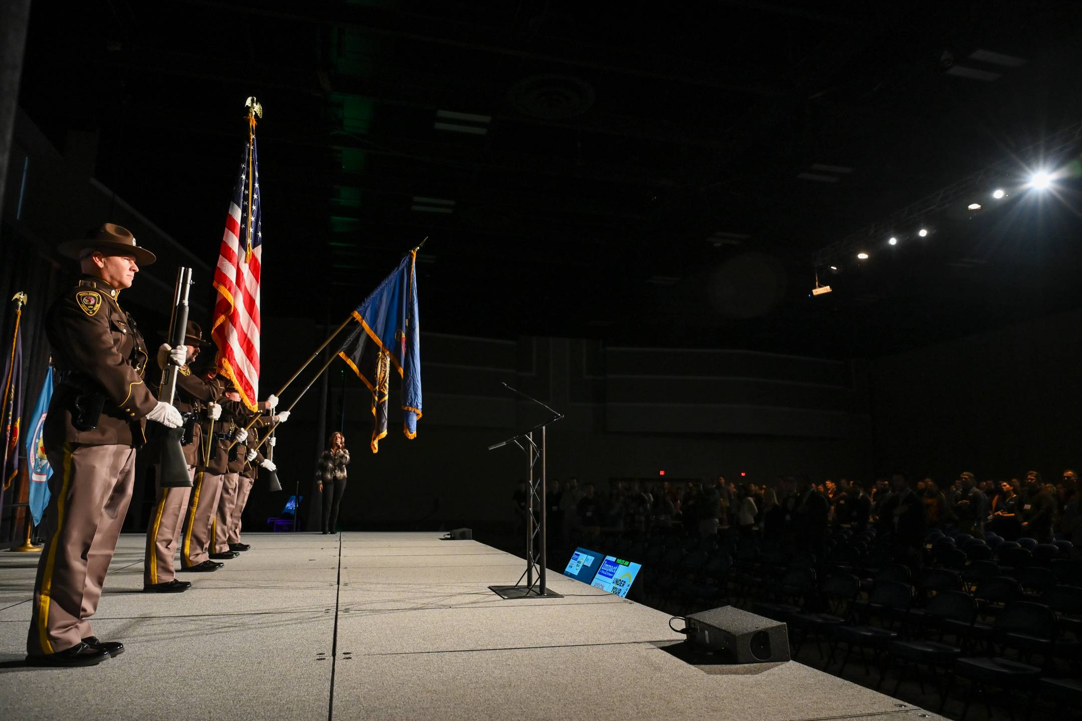 The North Dakota Highway Patrol Honor Guard presents the state colors at the 2025 North Dakota Transportation Conference.